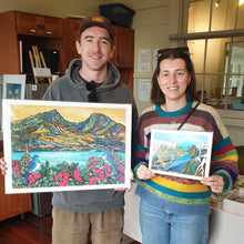 Load image into Gallery viewer, Customers at the Raglan Creative Market. Purchased 'I See You' Art Print and 'Milford Sound' Art Print