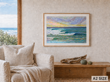 Load image into Gallery viewer, A framed art print depicting a textured, impressionistic ocean scene with waves under a colorful sky, styled on a beige wall above a wooden bench and next to a beige armchair.