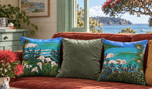 Load image into Gallery viewer, Cushion Covers by New Zealand artist Miranda J Caird on a red velvet couch with pohutukawa blossoms