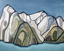 Load image into Gallery viewer, Stylised mountain landscape painting with layered contour-like geological forms in soft blues, greens, creams, and ochres above calm blue water, framed in natural wood.